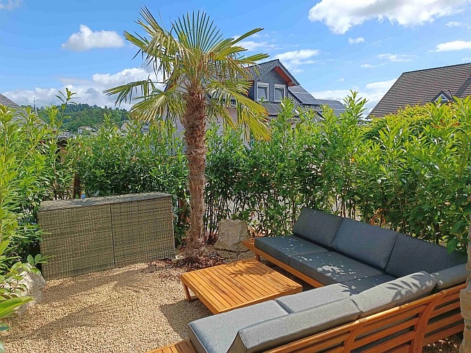 Ferienwohnung Chalet Seenähe - Loungeecke Palmengarten