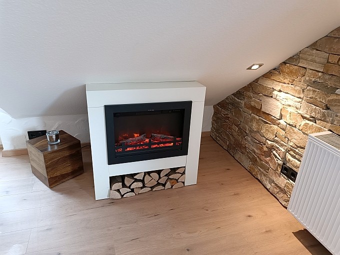 Ferienwohnung Traum-Seeblick, gemütliche Atmosphäre mit hochwertigem E-Kamin